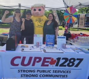 CUPE 1287 members at Ribstock with the mascot a big pig