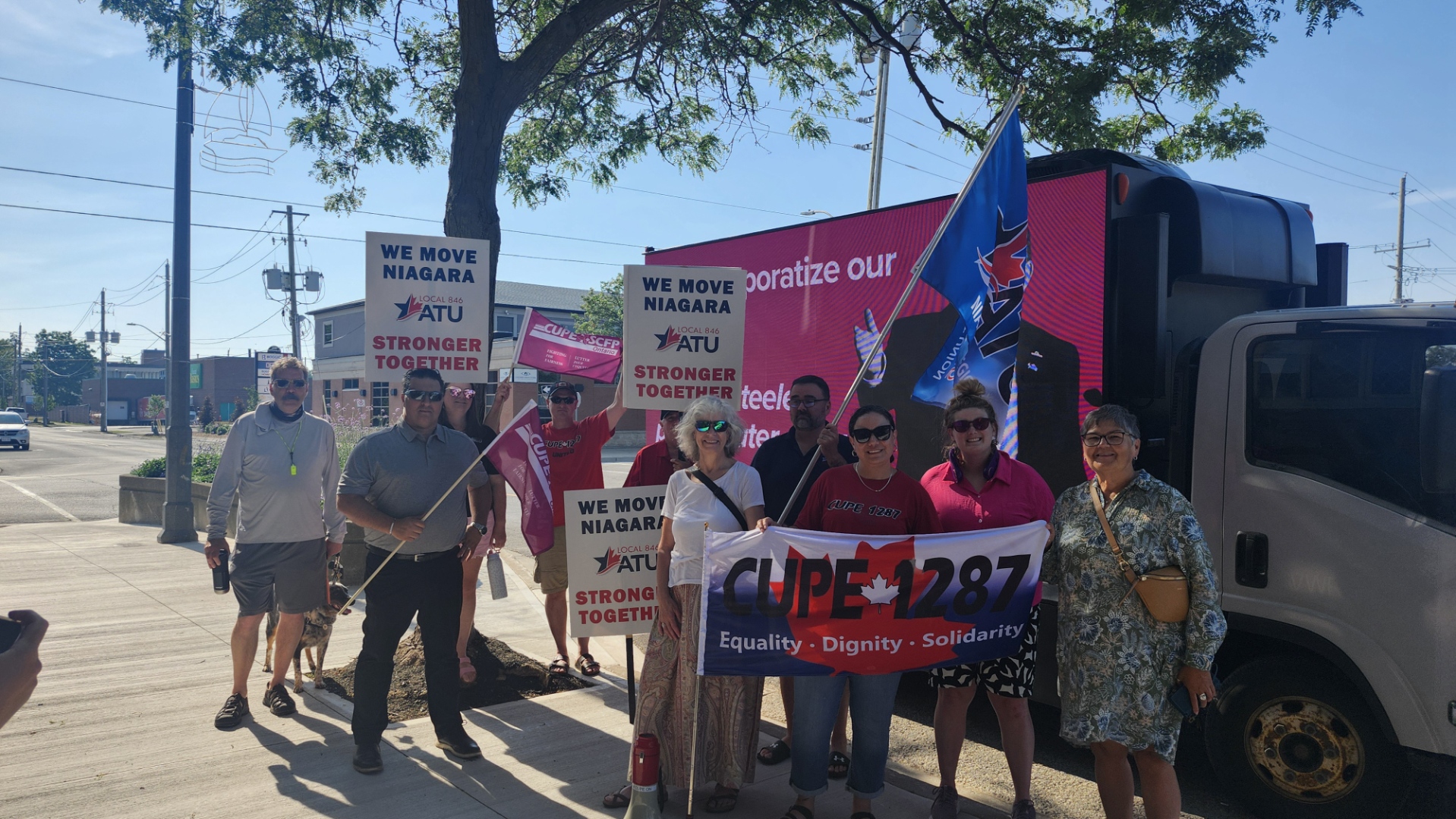 Union members hold placards